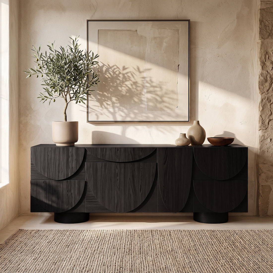 Black sideboard styled in a bright modern living space