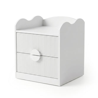 White modern nightstand with wavy top edge, grooved drawer fronts, and central circular handle