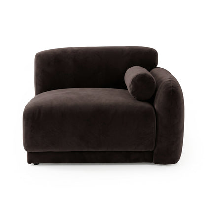 Plush dark brown armless upholstered chair with bolster pillow on white background