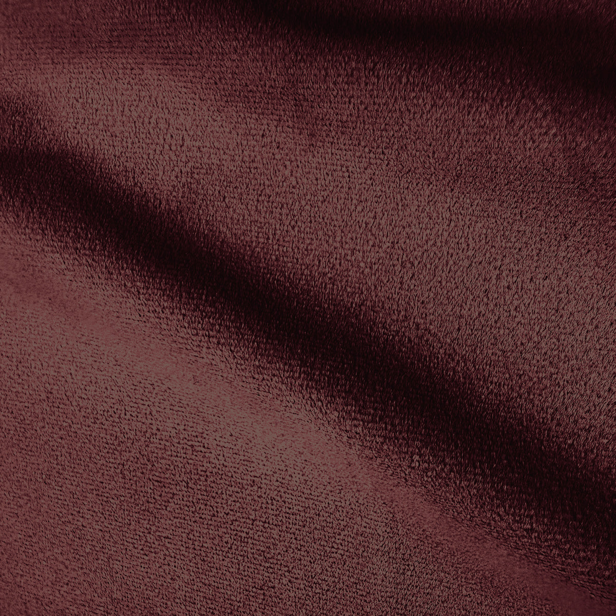 Close-up of burgundy sofa fabric texture.