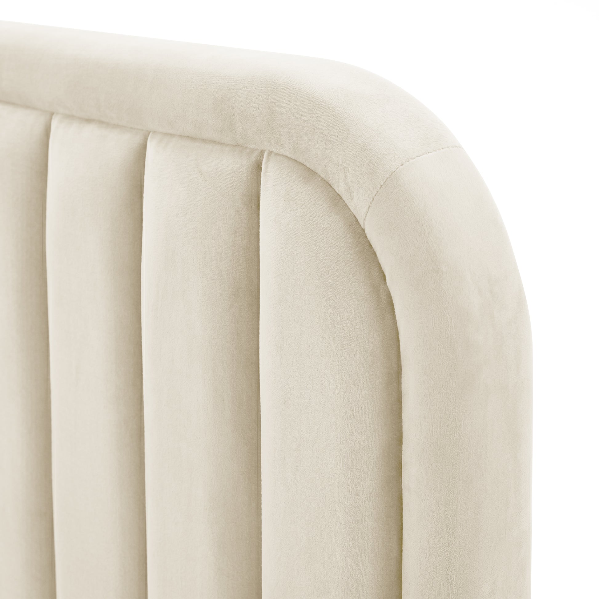 Close-up of beige upholstered headboard corner channel detailing