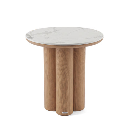 Round accent table with a white marble-look top and three cylindrical wooden legs on a white background