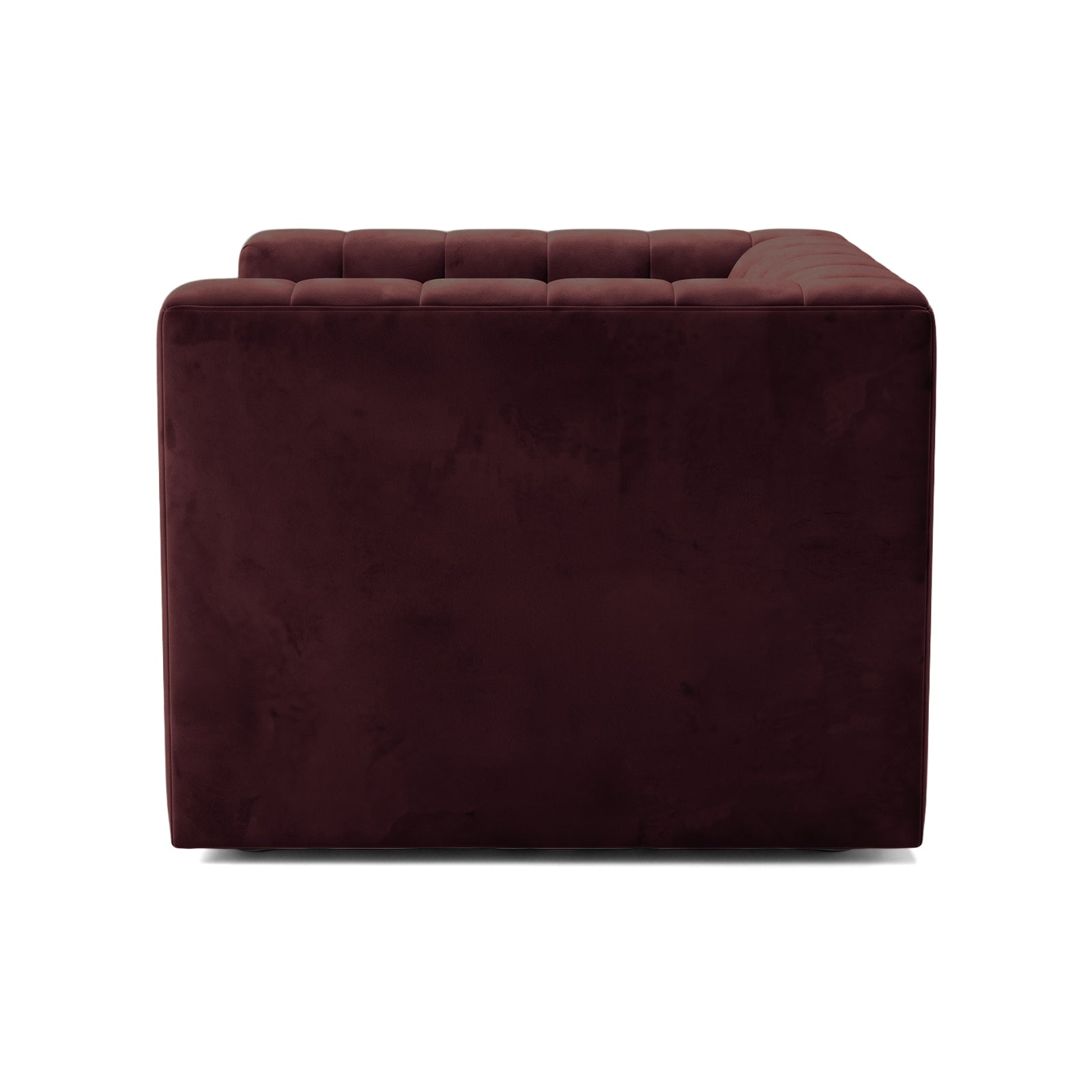 Partial side view of a burgundy sofa piece on a white background
