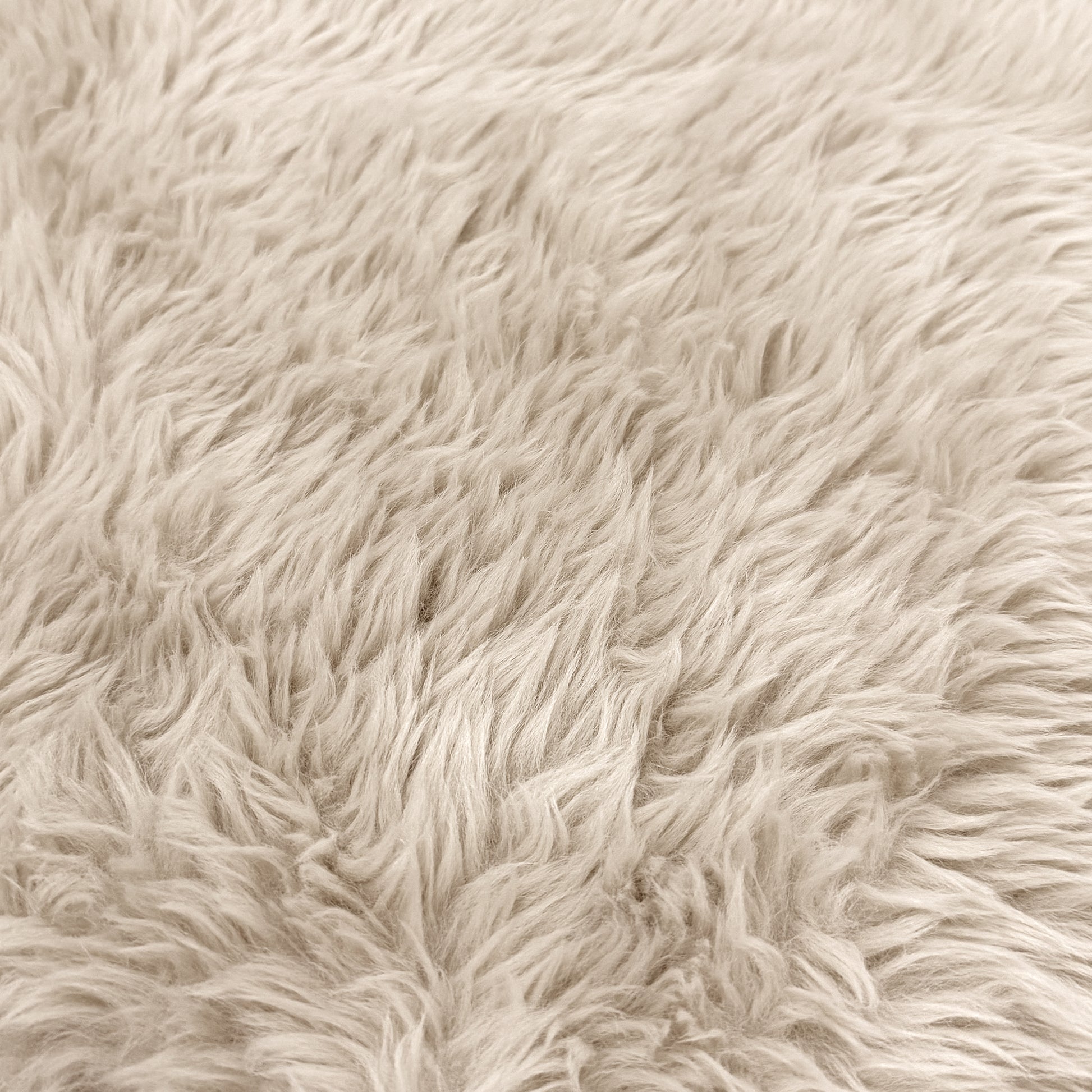 Extreme close-up of beige faux fur texture