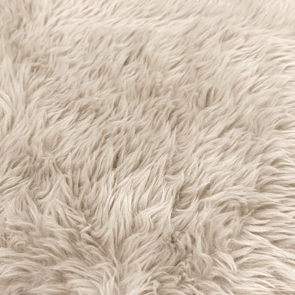 Extreme close-up of beige faux fur texture
