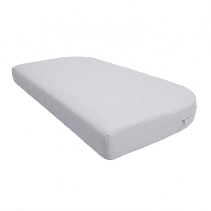 Light gray mattress on white background showing side profile