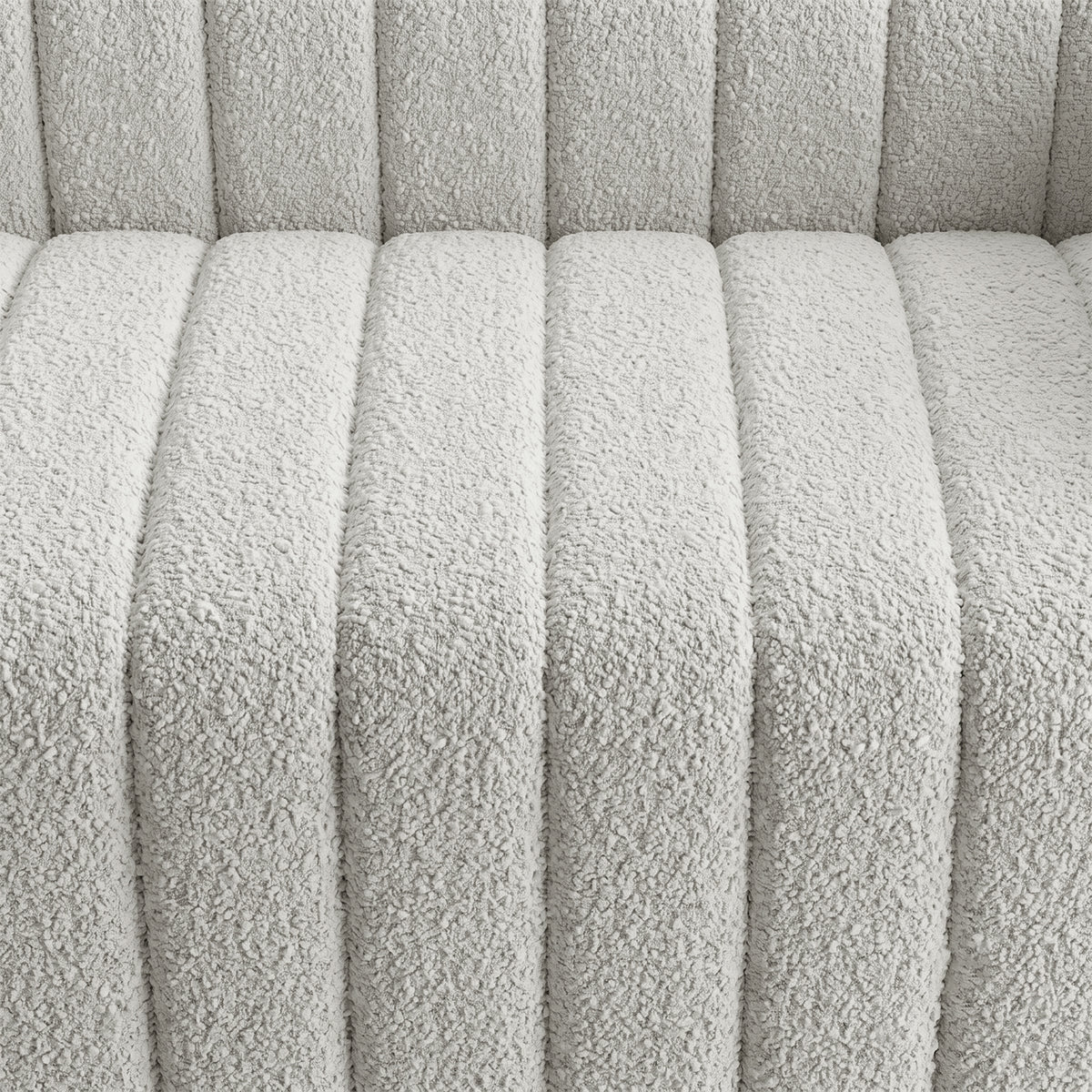 Close-up of light textured upholstered fabric with channel stitching
