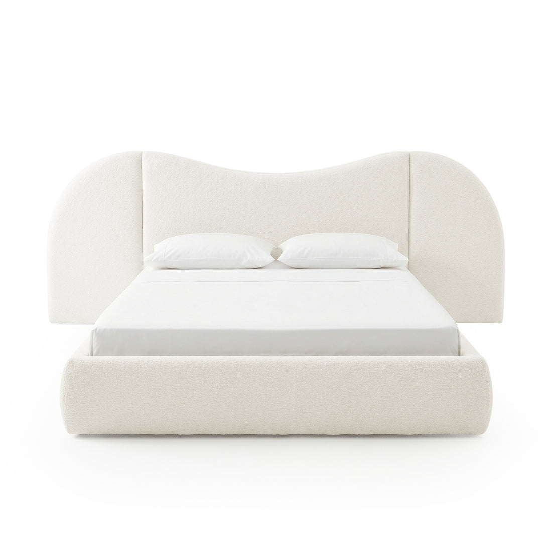 Contemporary upholstered bed with sculpted headboard on white background
