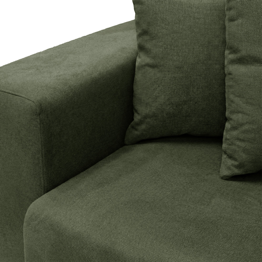 Angle close-up of green sofa corner and cushions on white background