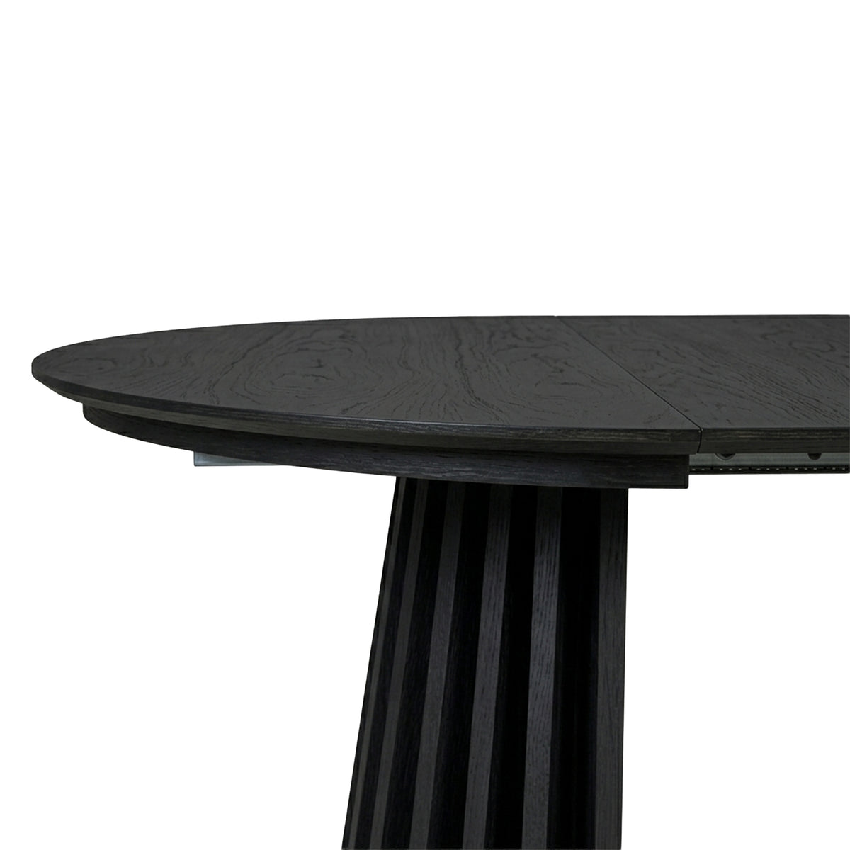 Close-up of a dark wood dining table end and base on white background