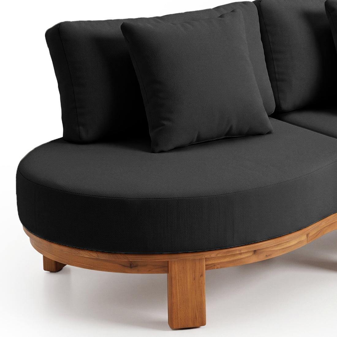 Partial view of a modern curved sectional sofa with black cushions on white background