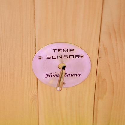 Temperature sensor mounted on a wooden wall