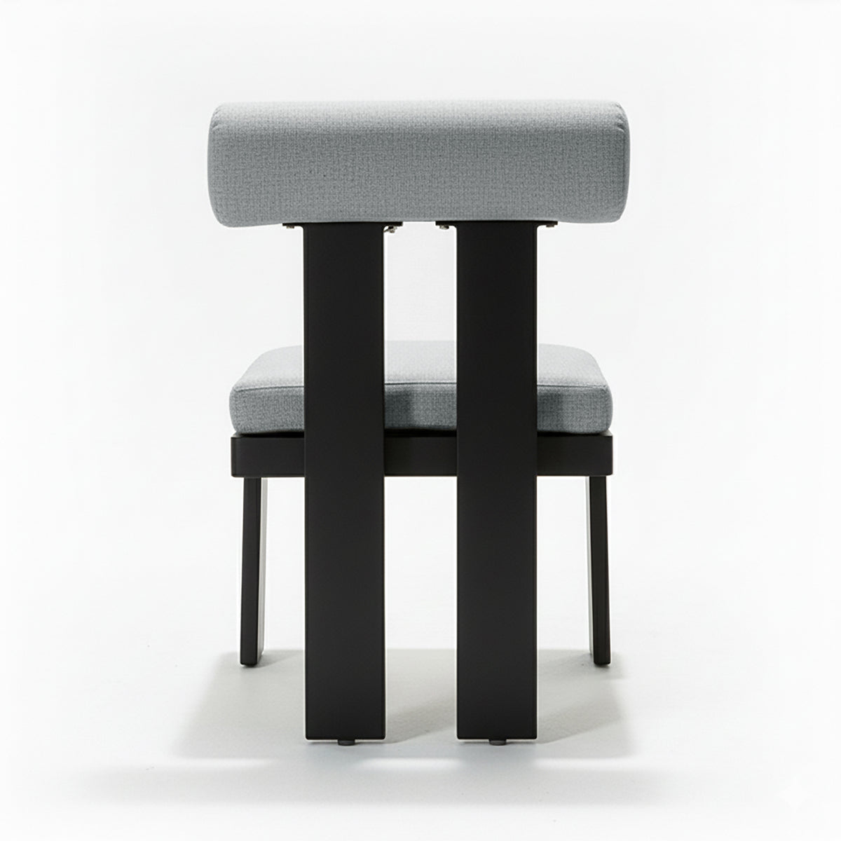 Positano 6 Seater Outdoor Dining Set in Black & Grey features a minimalist chair with light-gray upholstered seat and backrest on a sleek black metal frame, emphasizing modern design.