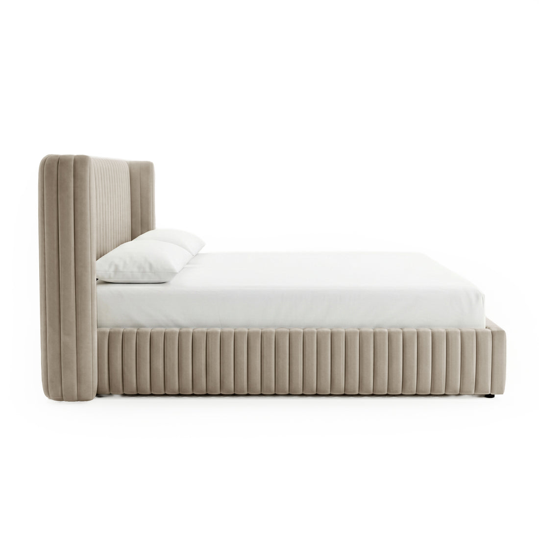 Side profile of beige upholstered king bed on white background