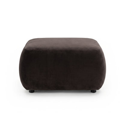 Square dark brown upholstered ottoman with rounded edges on white background