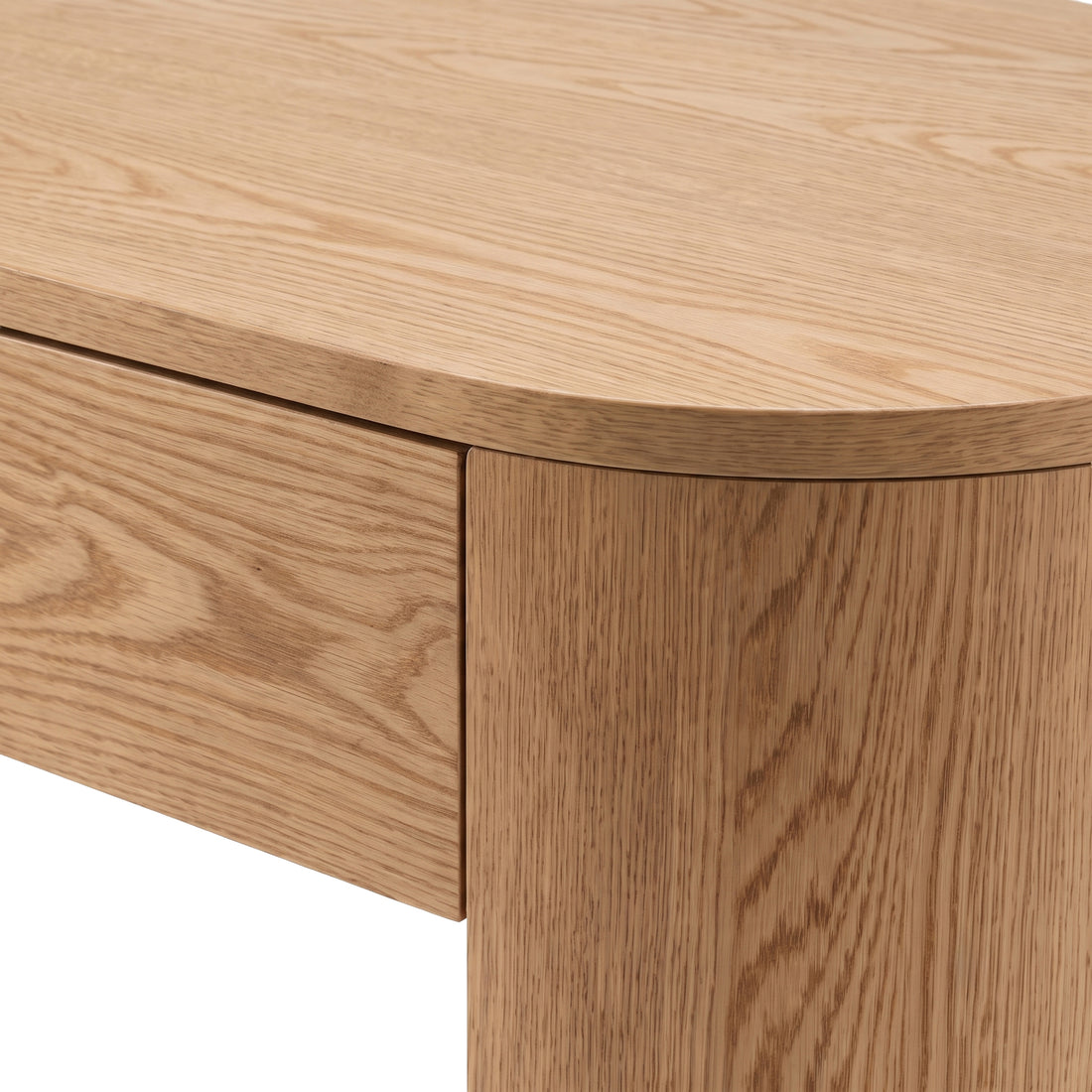 Close-up of rounded wood desk corner on white background