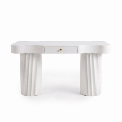 White modern desk with curved tabletop, centered drawer, and fluted cylindrical legs on a white background