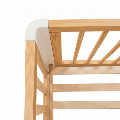 Close-up of wooden crib slats detail on white background