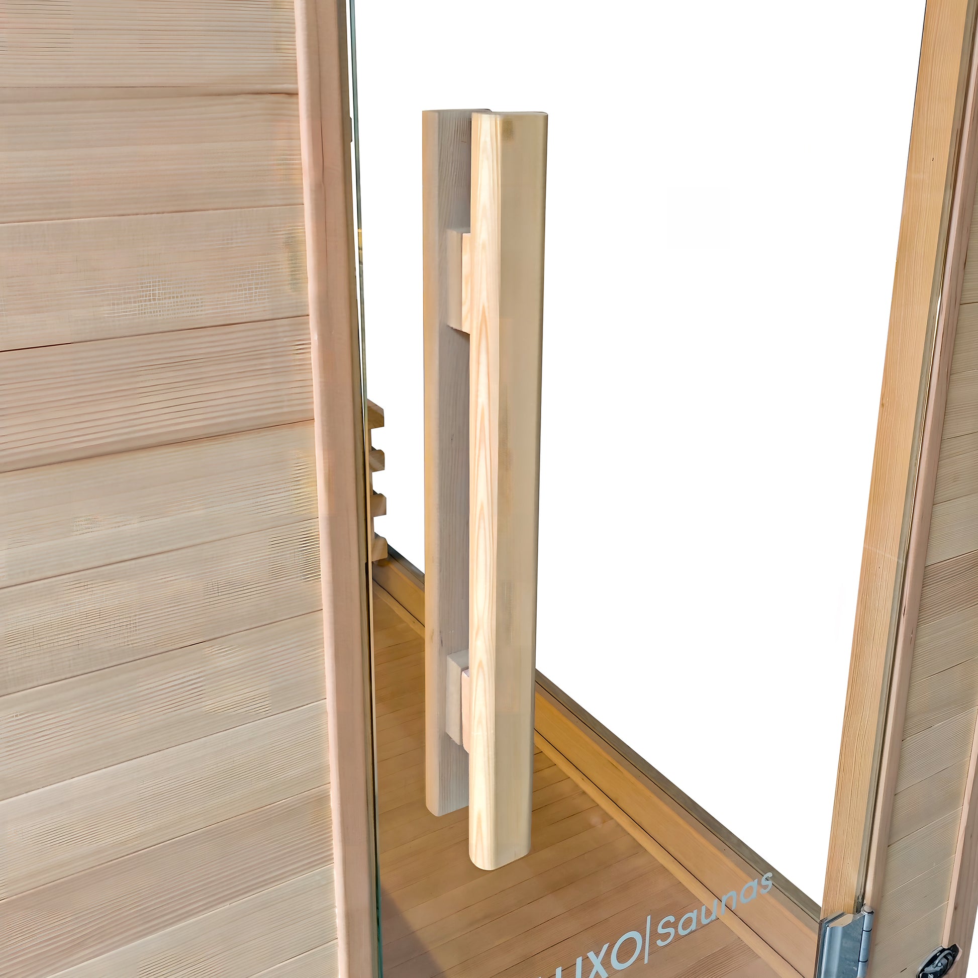 Close-up of a wooden sauna door handle and paneling