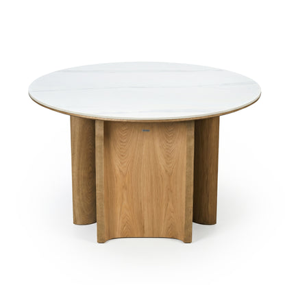 Modern round table with white top and geometric wooden base on white background